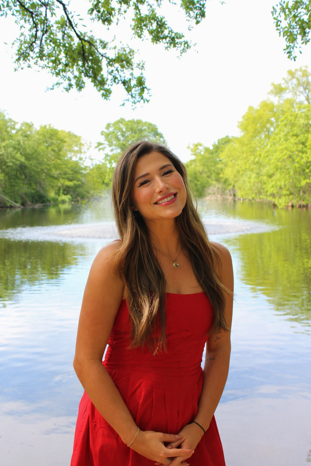 Morgan smiling beside the water