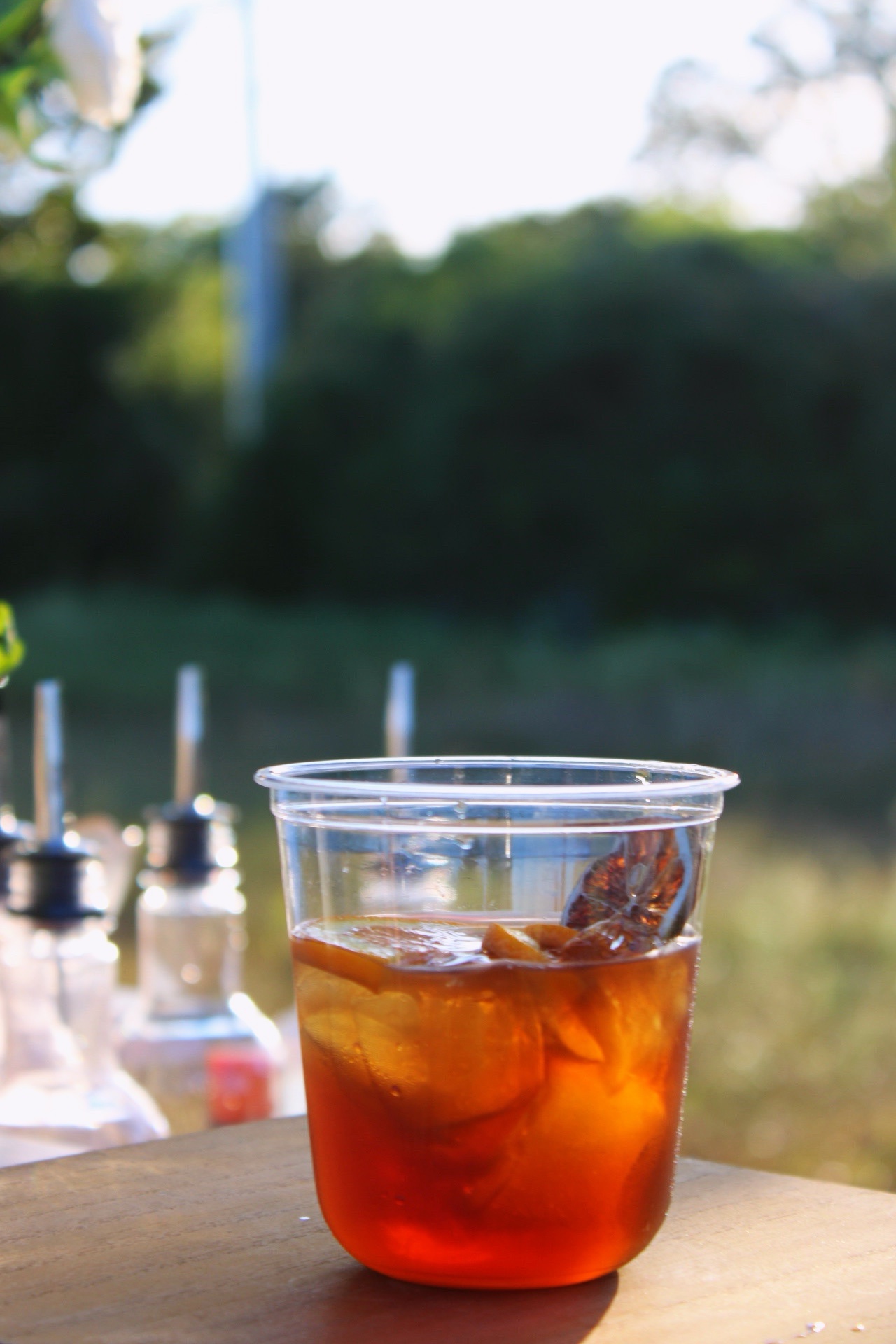A Maple Old-Fashioned beside a framed Book That Bar sign