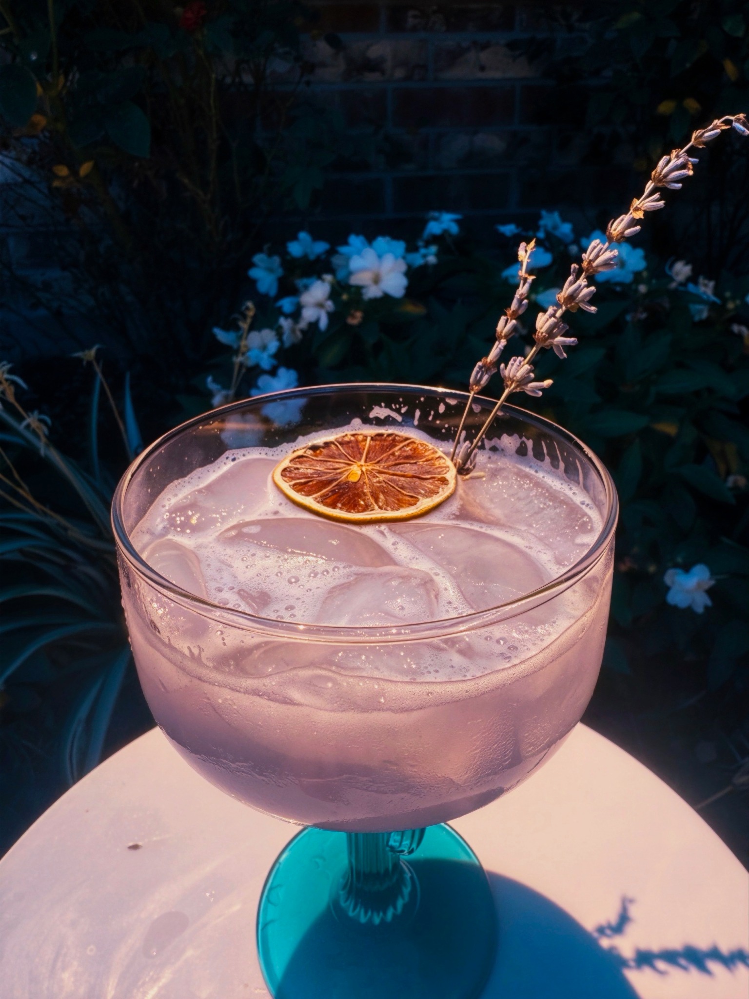 Lavender Margarita with a dried citrus wheel and lavender garnish